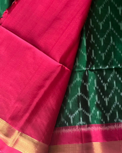 Emerald green chevron body and royal pink blouse with zari border