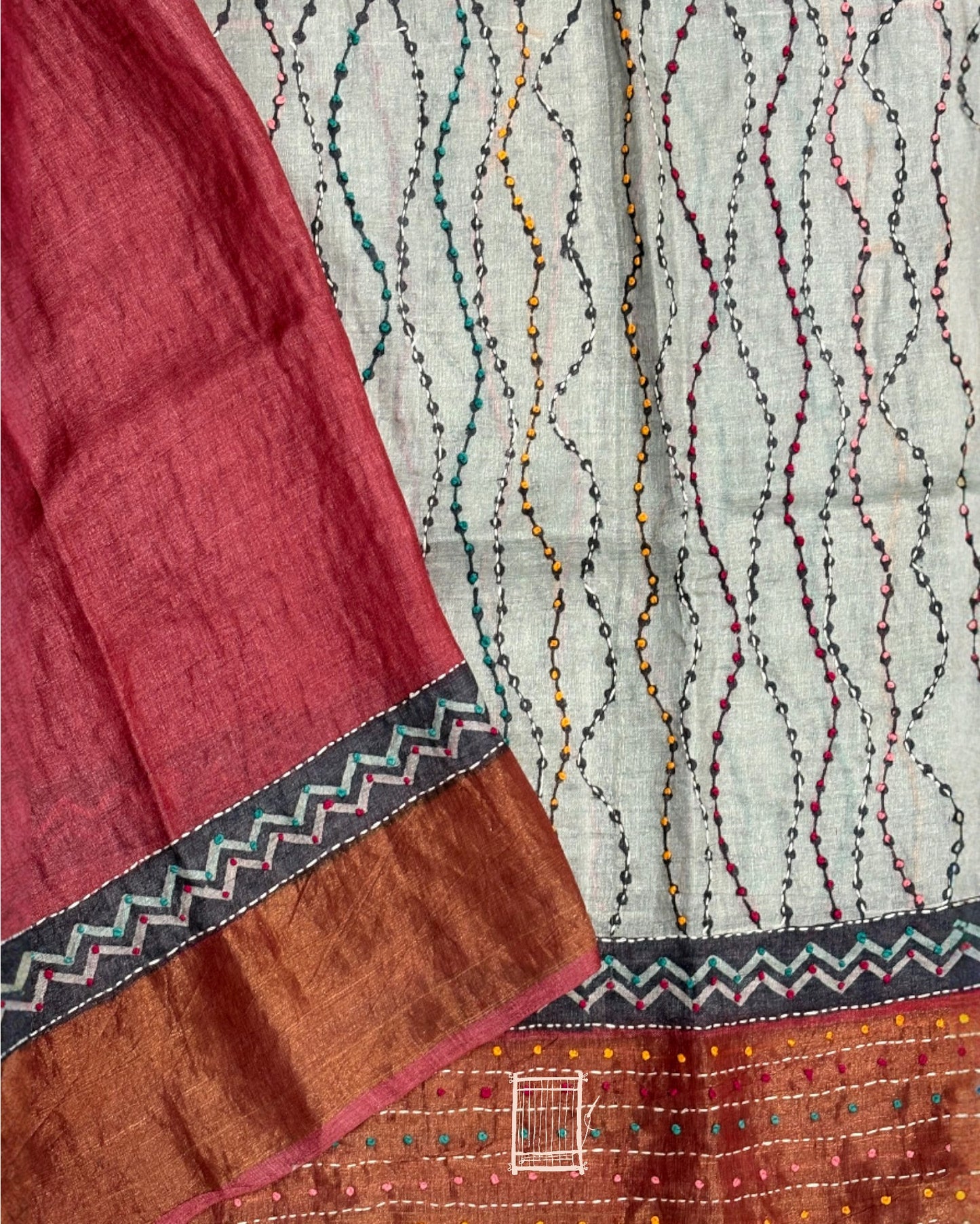 Contrast red blouse with zari and light embroidery border