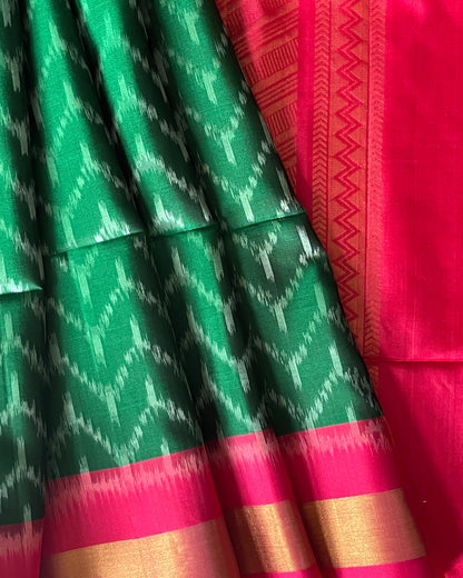 Close-up of silver chevron ikat on emerald soft silk