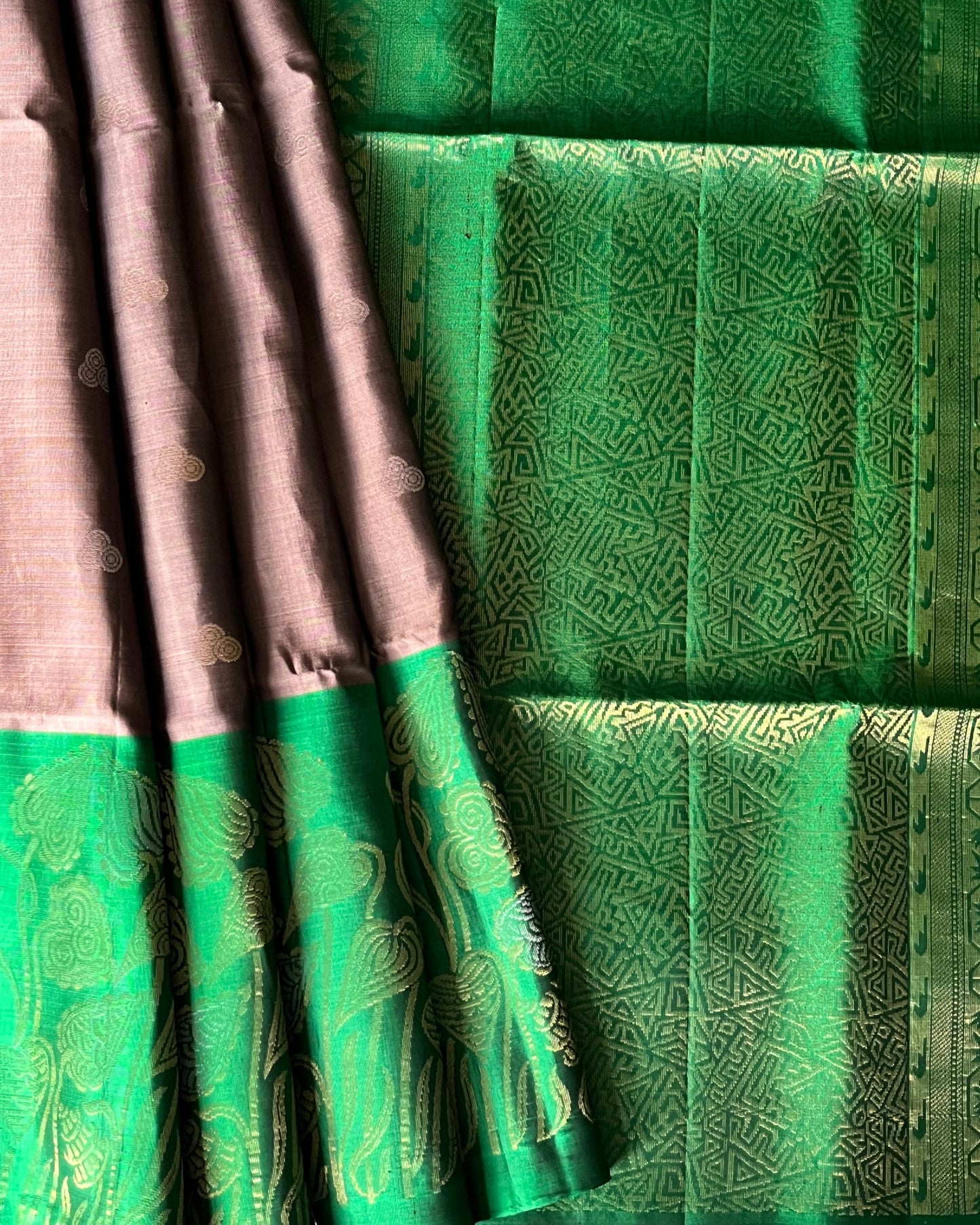Gold vine border and moon buttis on chocolate pleats – Emerald green geometric pallu